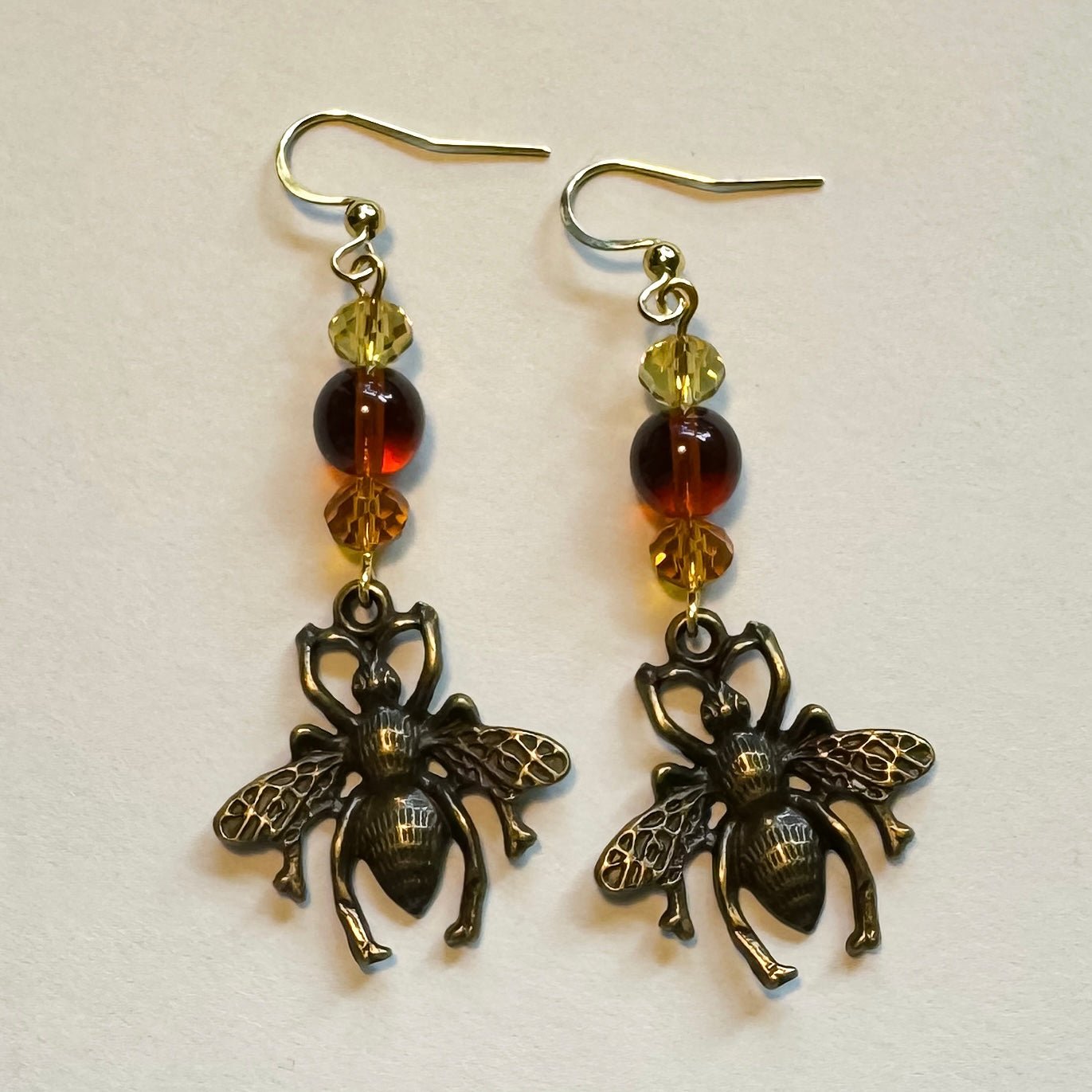 Bronze bee glass beaded dangle earrings - Earrings - Made by Saskia