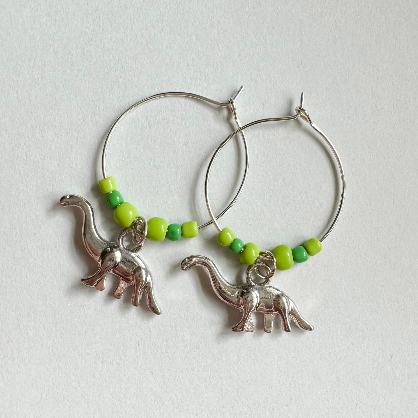 Green dinosaur beaded hoop earrings - Earrings - Made by Saskia