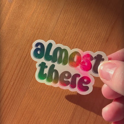 ‘Almost there’ holographic sticker